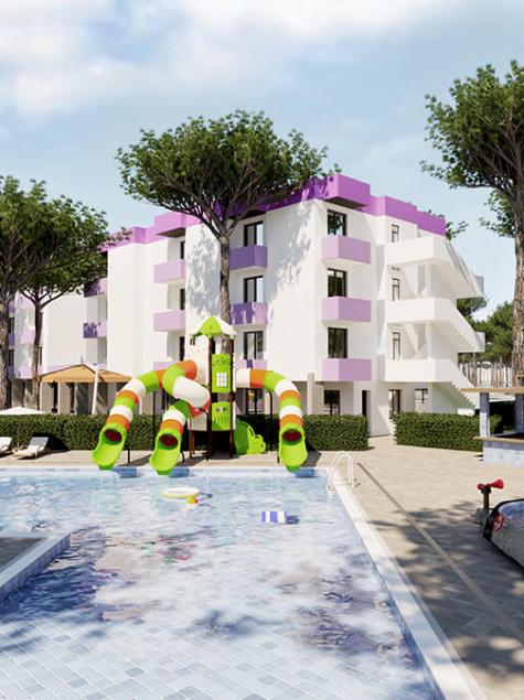Piscine avec toboggans colorés, bâtiments modernes, arbres luxuriants, ambiance de vacances.